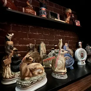 a shelf full of liquor bottles