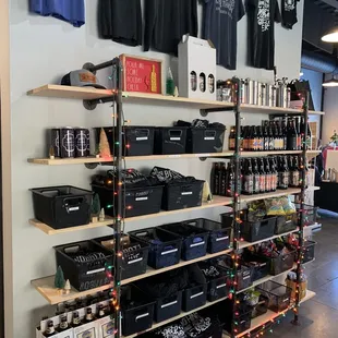 a display of bottles and t - shirts