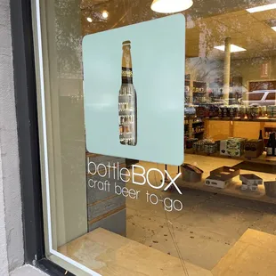 a bottle of beer in the window
