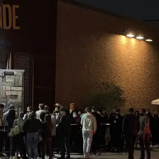 Huddled crowds outside with no distancing, many people without masks, and not limiting capacity like they should.