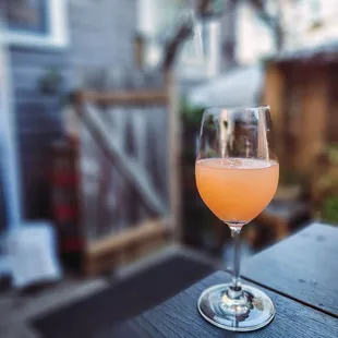 a glass of wine on a table