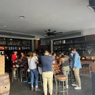 a group of people at a bar