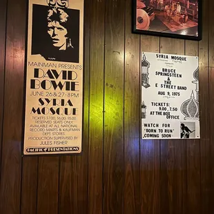 a bar with posters on the wall