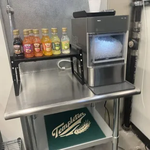 a counter with a microwave and ice