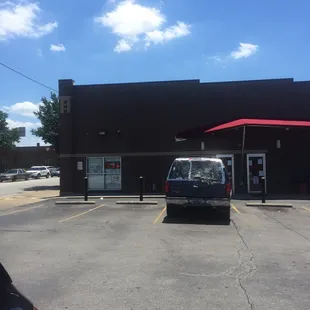 a car parked in front of a store