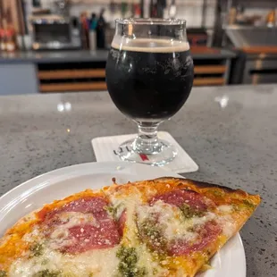 Flat bread pizza. Salami, cheese and pesto. Cinnamon Stout from Firestone.