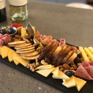 a platter of cheese and meats