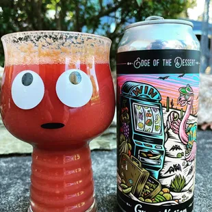 a glass and a can of beer