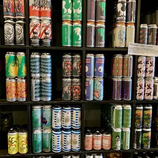 a shelf full of cans of beer