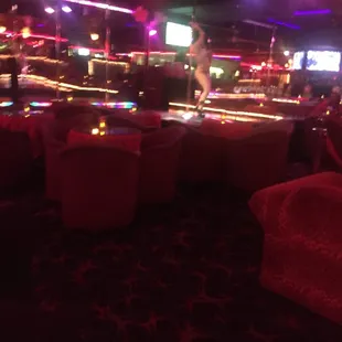 a bar with a lot of tables and chairs