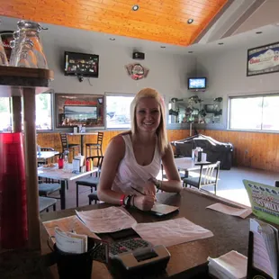 a woman sitting at a table