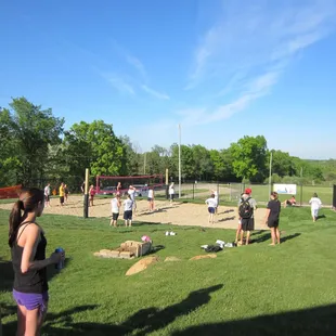 a group of people playing volleyball