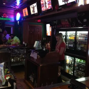 a woman behind the bar
