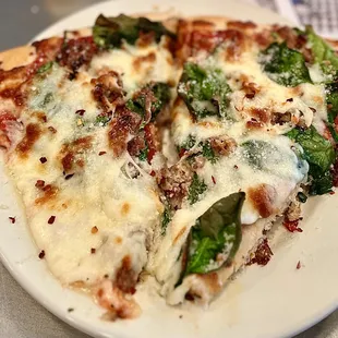 a slice of pizza on a plate