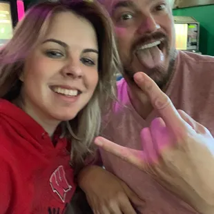 a man and a woman posing for a picture