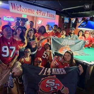 a group of people holding a banner