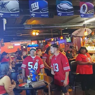 a group of people at a bar
