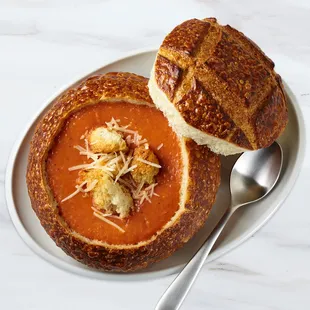 a bowl of soup and bread