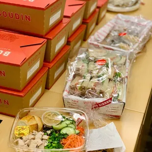 Lunch boxes, sandwich tray, and dessert basket from Boudin catering