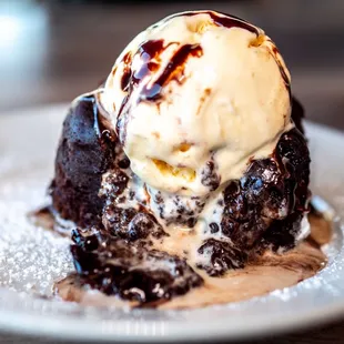 a dessert with ice cream and chocolate sauce