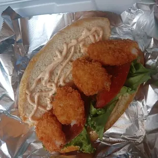Shrimp po boy with creole mayo lettuce and tomato we make our own creole mayo