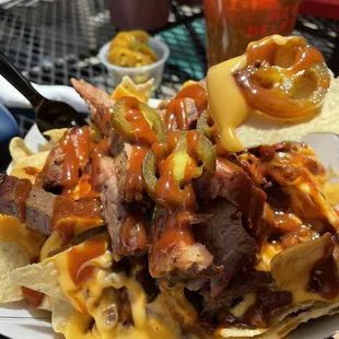 Nachos with brisket and jalapeños!