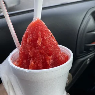 a hand holding a cup