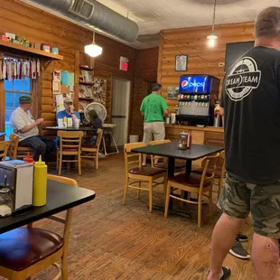 a man standing in a restaurant