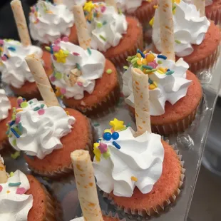 cupcakes with white frosting and sprinkles