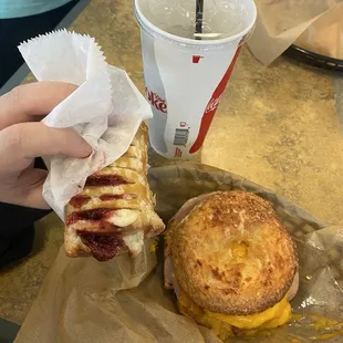 Cream cheese pastry, water, and meat lover bagel sandwich