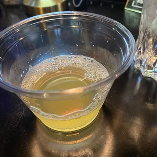 a bowl of liquid on a table