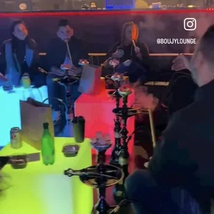 a group of people sitting around a table