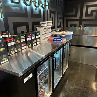 a counter with drinks and snacks