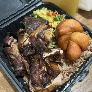Jerk Oxtails, rice and peas, cooked cabbage and festival!