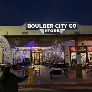 a woman walking in front of the store