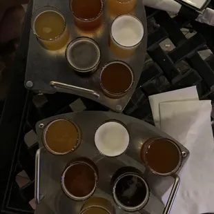 Beer flight (powder monkey Pilsner, Hells whole here, powerhouse pale ale, ocho loco IPA, coffee and cream stout, rattlesnake bite)