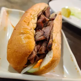 a beef sandwich on a plate
