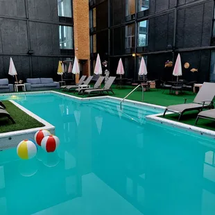 Nice pool with lounge chairs and tables