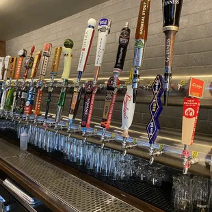 a row of beer taps