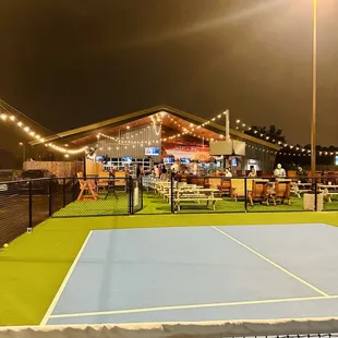 a tennis court at night