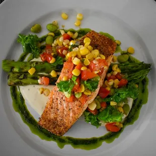 a plate of fish and vegetables