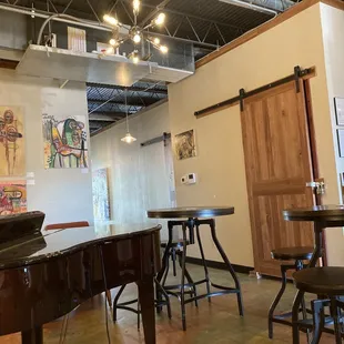 Piano and artwork in the back