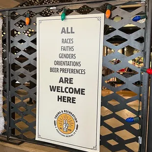 a sign in front of a gate