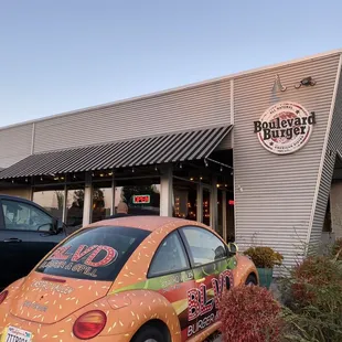 a car parked in front of a restaurant