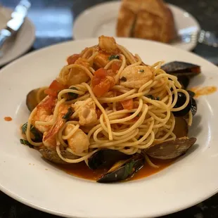 Tutto Mare (Spaghetti in a red sauce with mussels, clams, shrimp and fish)