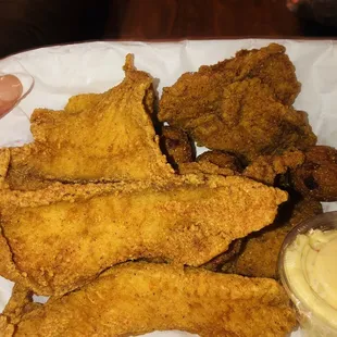 Catfish and Sole dinner with potato salad and hush puppies.