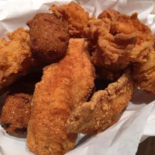 5 fried red snapper, 5 fried prawns, and hush puppies