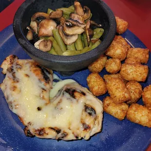 Monterey chicken, tater tots and green beans. Very good still even though the chicken was a little tough.