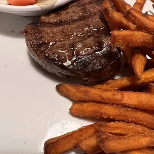 Sirloin steak with sweet potato fries and cucumber/ tomato salad