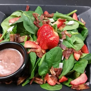 Spinach salad with raspberry vinaigrette dressing